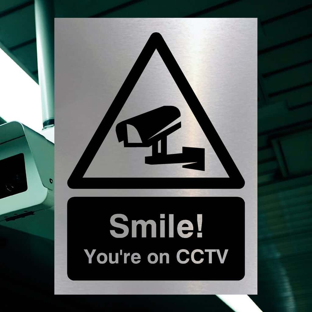 Smile You're On CCTV Sign in Brushed Silver - The Sign Shed